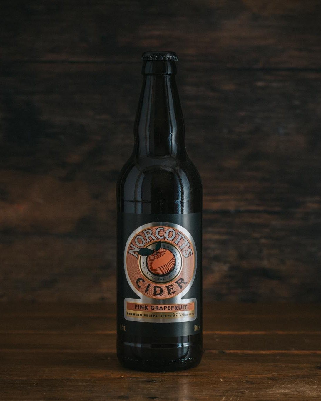 A 500ml bottle of Norcotts Pink Grapefruit Cider.