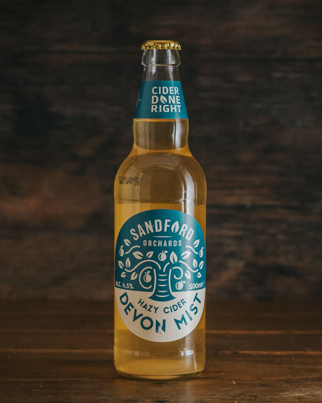 A 500ml bottle of Sandford Orchards Devon Mist Cloudy Sparkling Cider.