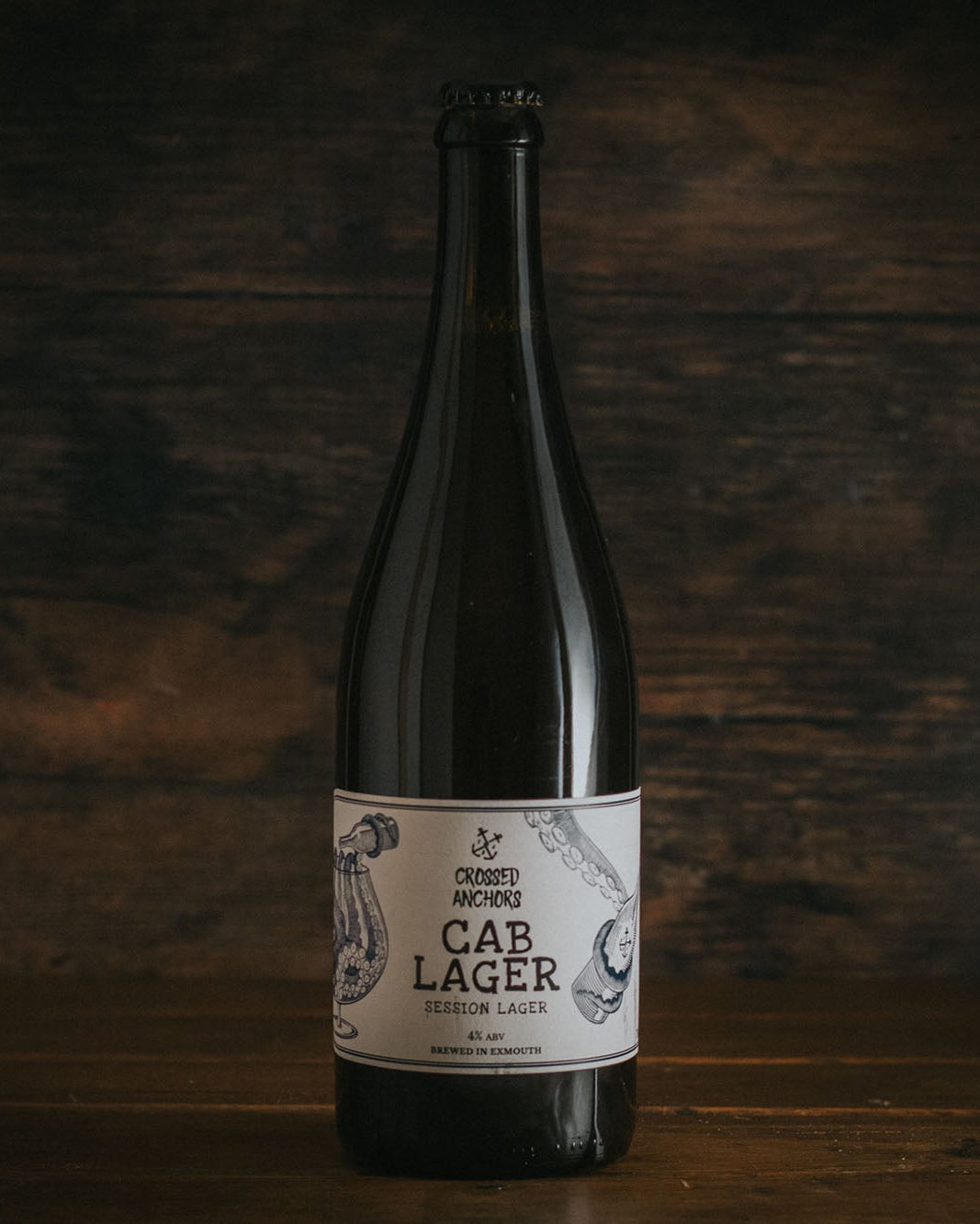 A bottle of Crossed Anchors Cab Session Lager.