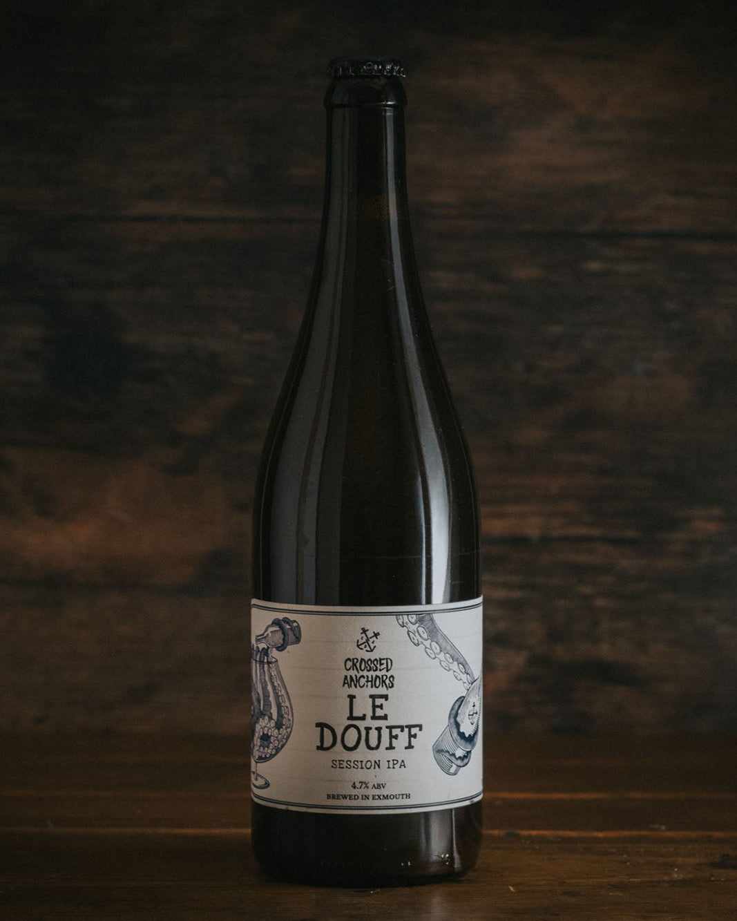A bottle of Crossed Anchors Le Douff Session IPA.