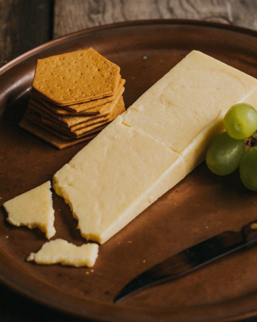 Green's of Glastonbury Twanger Cheddar (By Slice) | Greendale Farm Shop