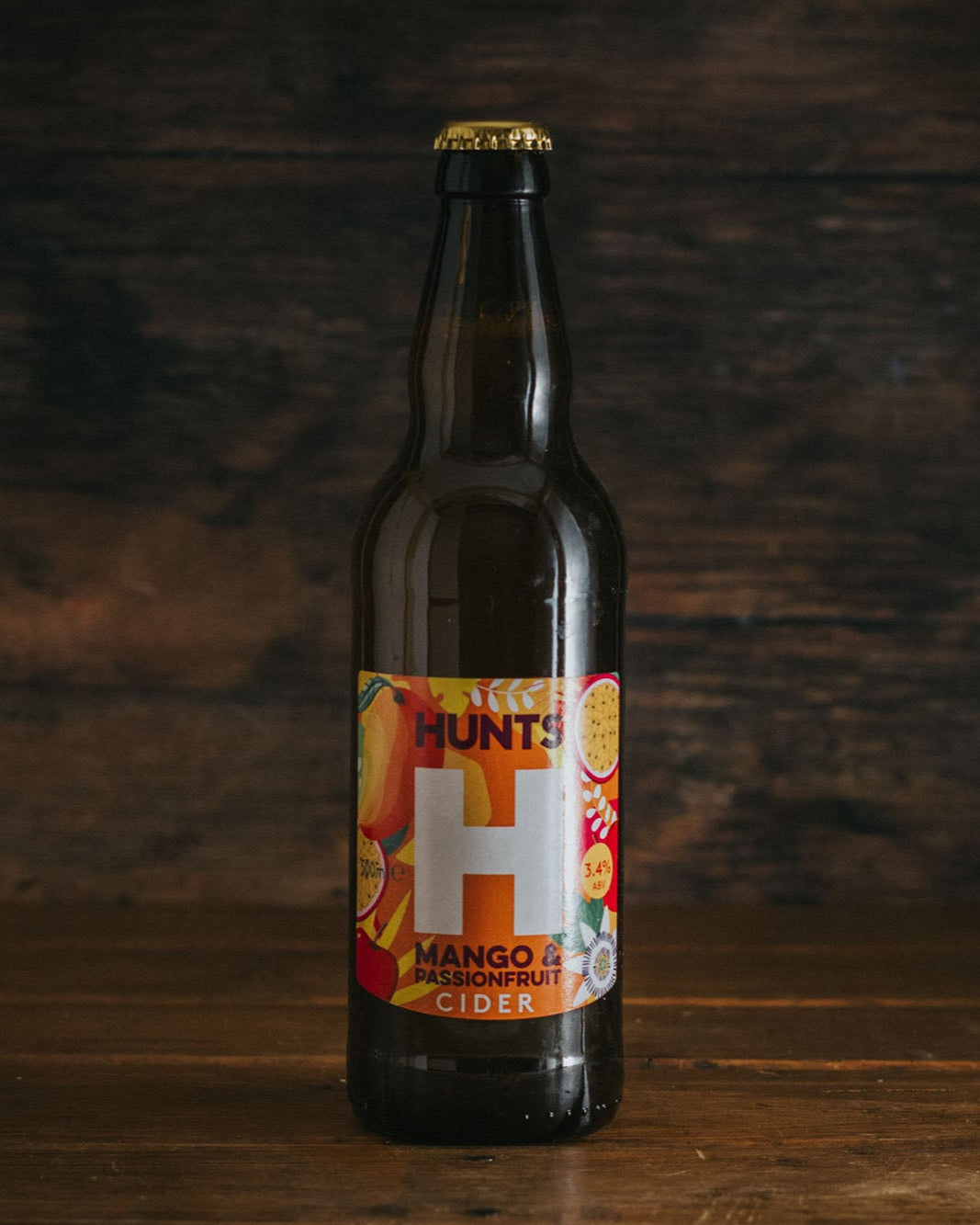 A 500ml bottle of Hunts Mango & Passionfruit Cider.