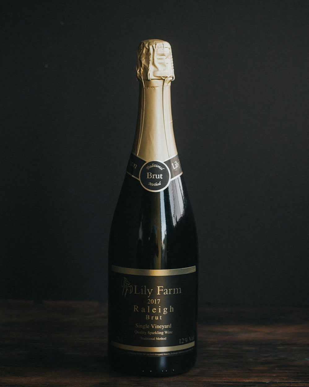 A bottle of Lily Farm Vineyard Raleigh Brut.