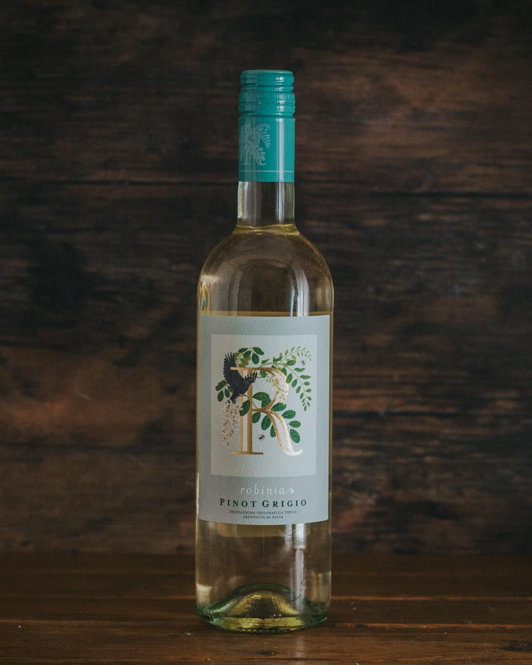 A bottle of Robinia Pinot Grigio Doc Delle Venezie.